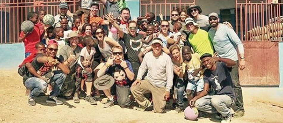 Antonio Edwards with a volunteer group and local children on a mission trip