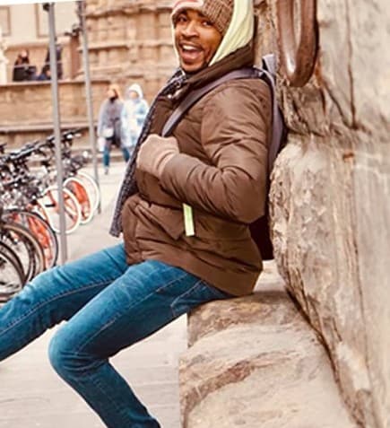Antonio Edwards smiling while traveling abroad